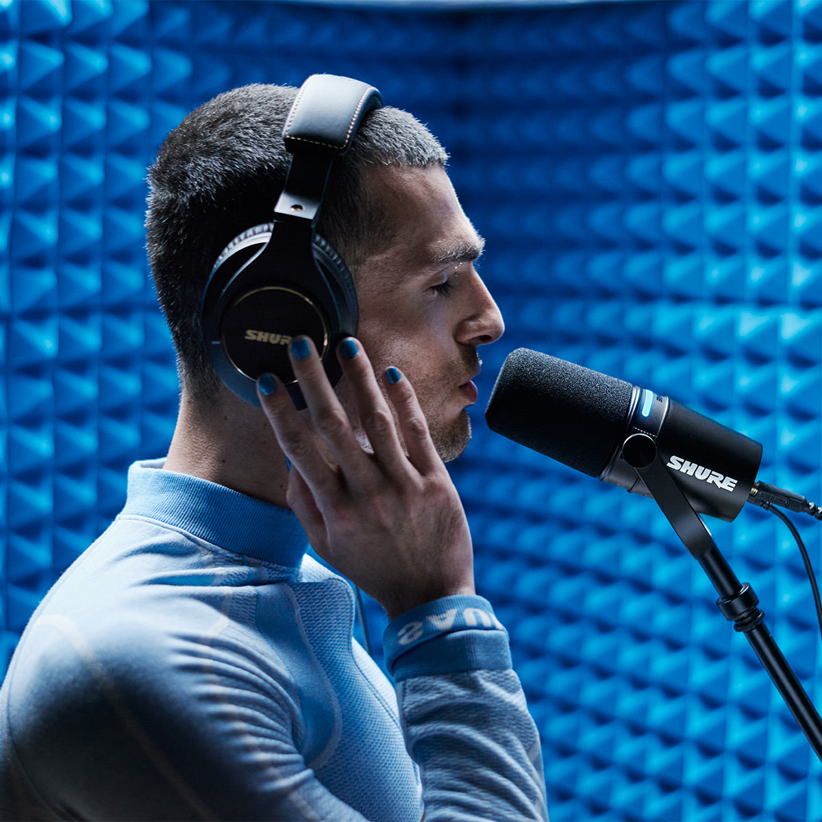 Shure MV7+ in use for vocal recording in an acoustic booth