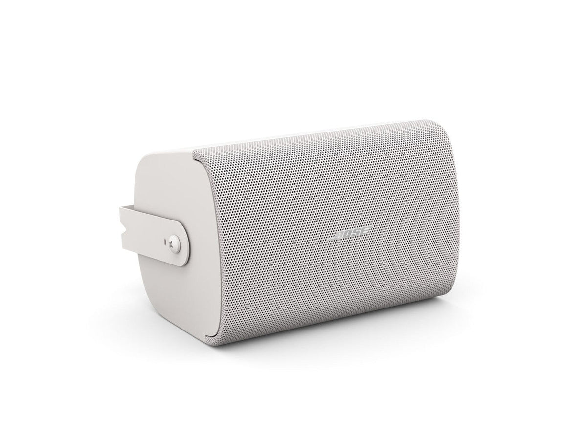 Bose FreeSpace FS4SE white surface mount loudspeaker pair, angled view with mounting bracket