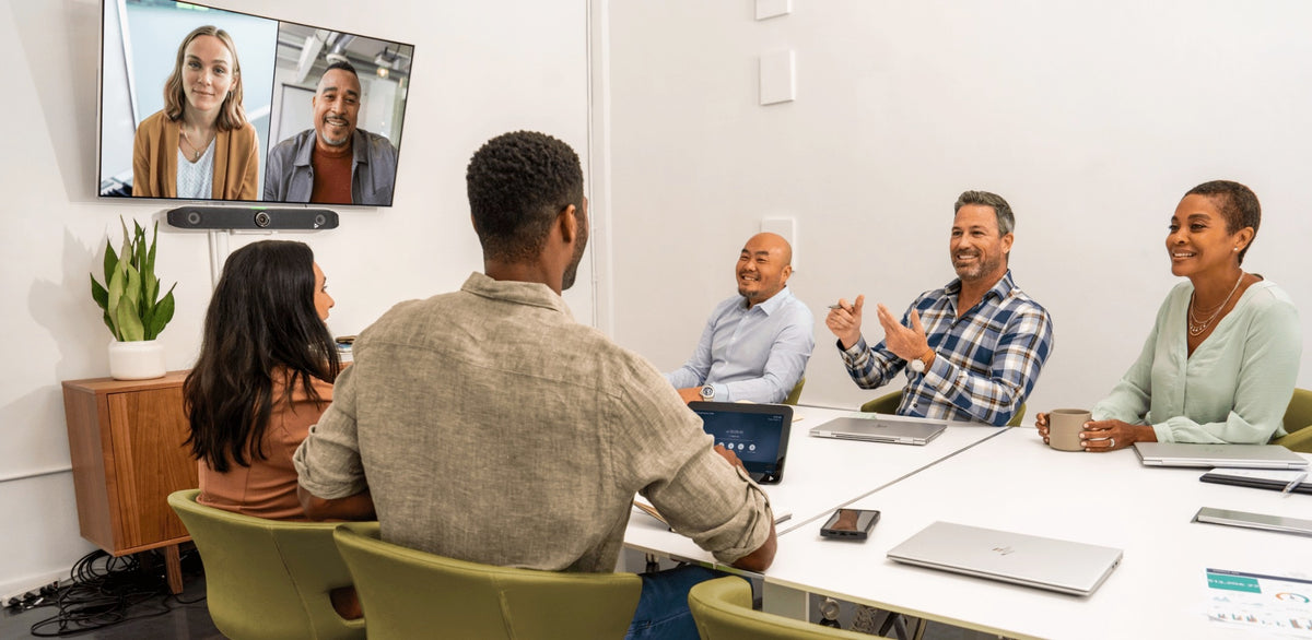 Poly Studio X52 video bar in mid-sized meeting room