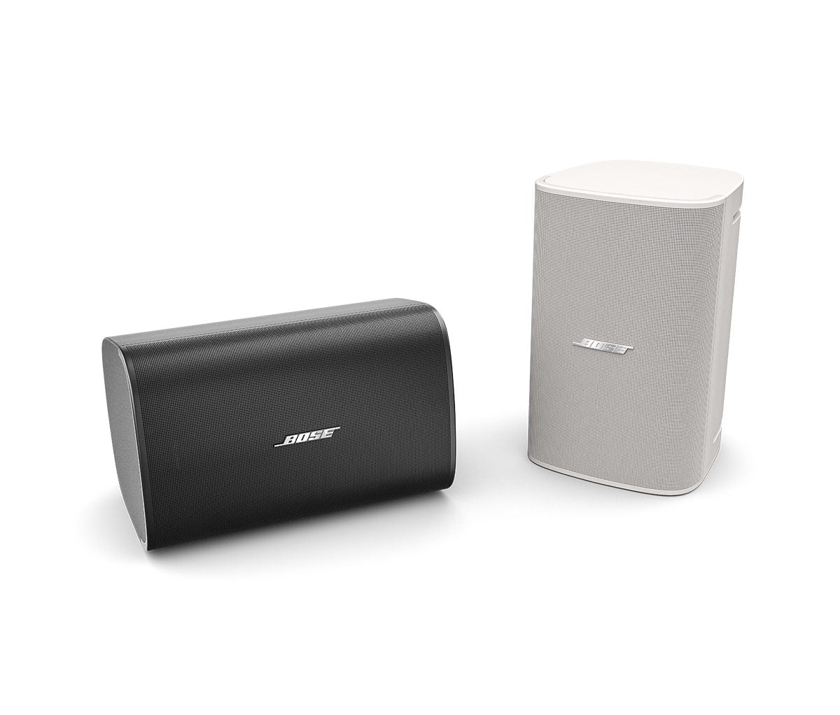 Bose DesignMax DM8SE white surface mount loudspeaker, shown alongside the black version