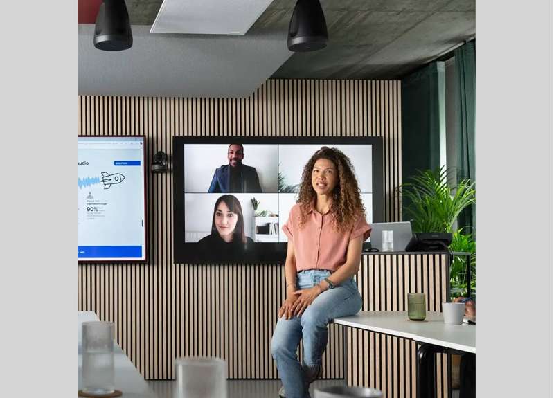 Shure MXA925 ceiling array microphone used in a hybrid meeting space